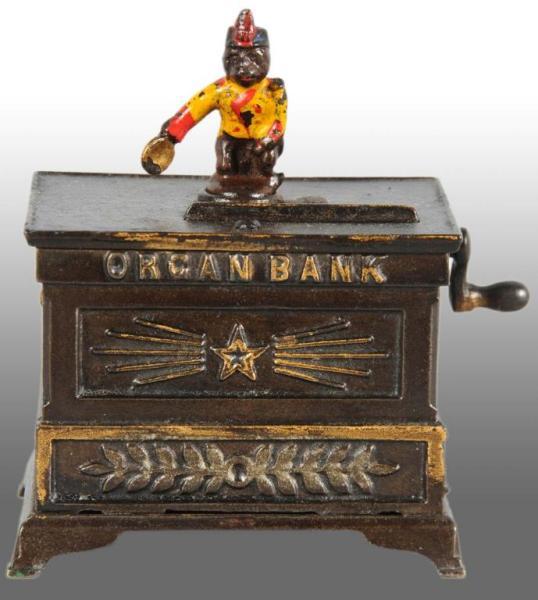 Appraisal: Cast Iron Organ Bank Miniature Mechanical Bank Description Circa s