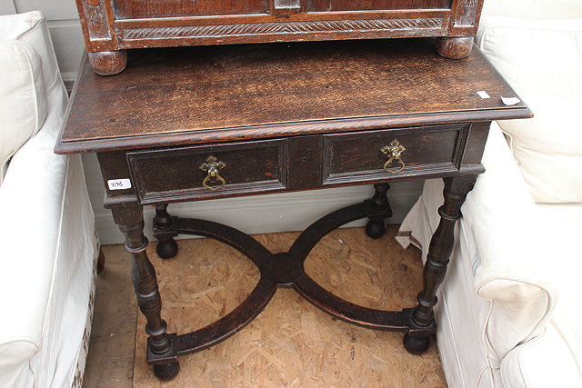 Appraisal: AN OAK SIDE TABLE with single frieze drawer and standing