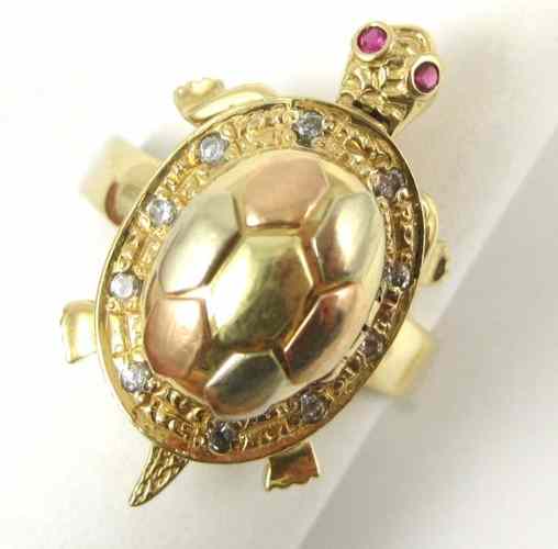 Appraisal: RUBY AND FOURTEEN KARAT GOLD TURTLE RING each eye is