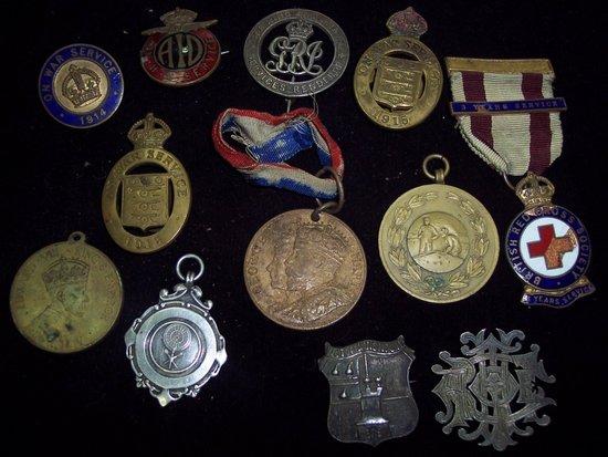 Appraisal: Two brass badges 'On War Service ' and sundry badges