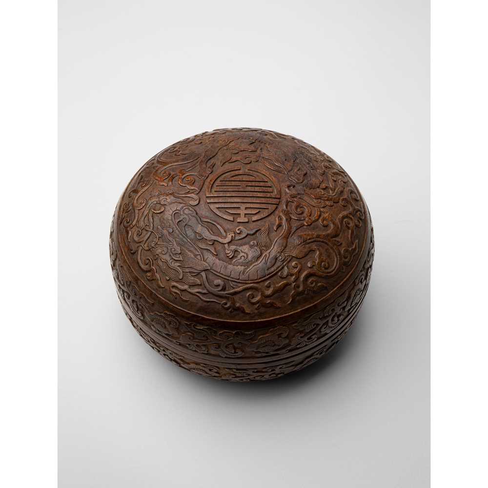 Appraisal: HUANGHUALI CARVED 'DRAGON' CIRCULAR BOX AND COVER QING DYNASTY TH