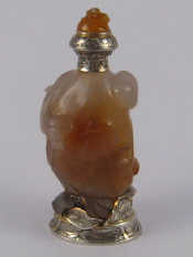 Appraisal: A French hallmarked silver and agate bottle carved in the