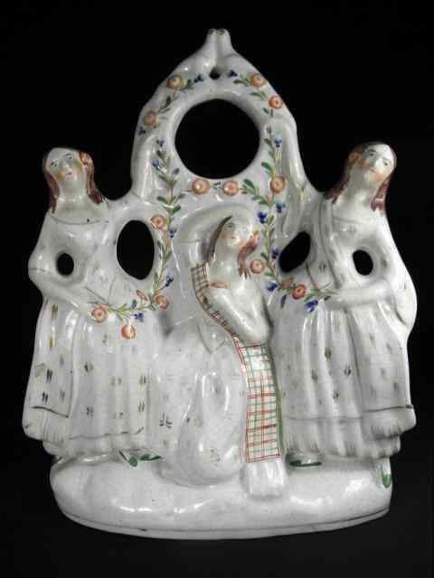 Appraisal: Staffordshire th century hand painted porcelain figural group Depicts three