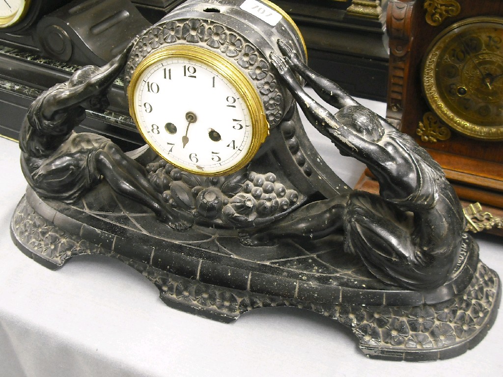 Appraisal: French black metal two train figural mantel clock the movement