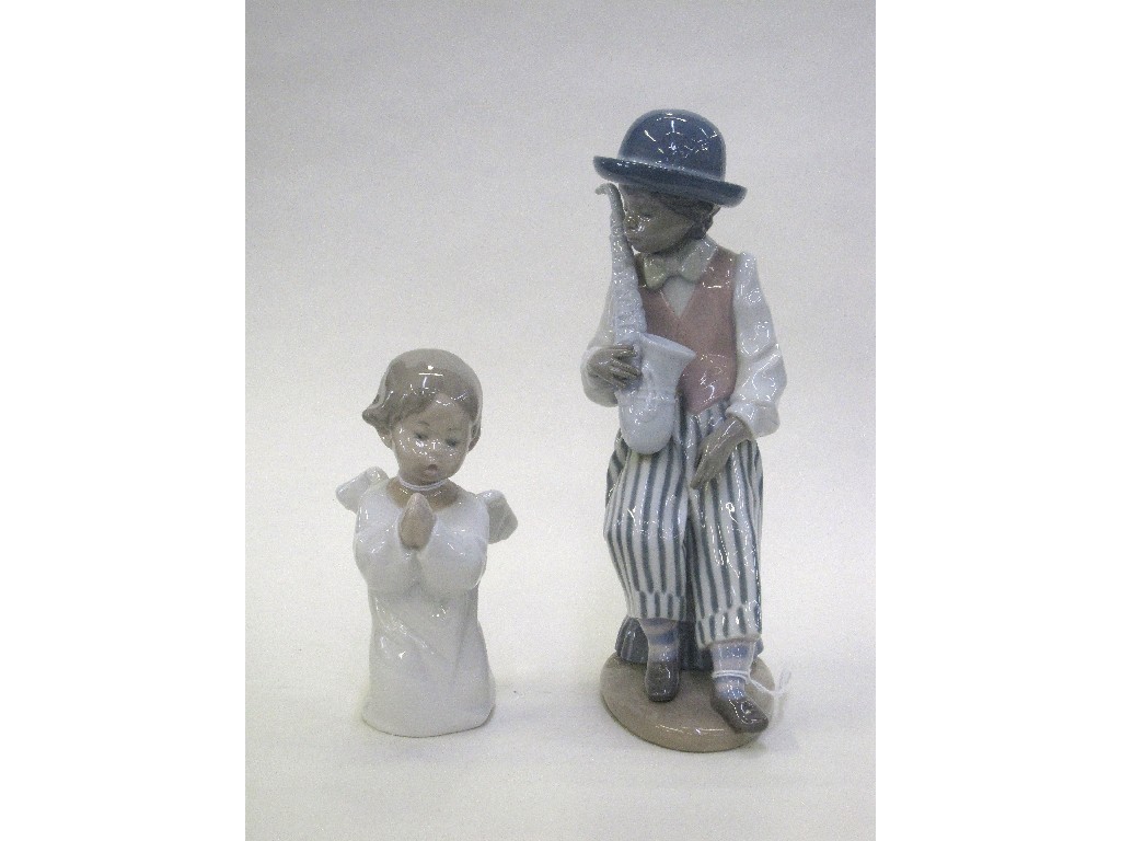 Appraisal: Lladro figure of a boy with a saxophone and another