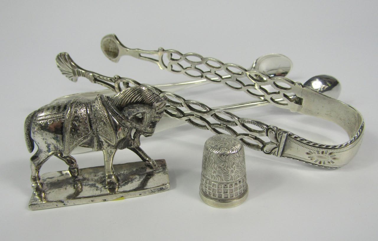 Appraisal: A pair of George III silver sugar tongs with openwork