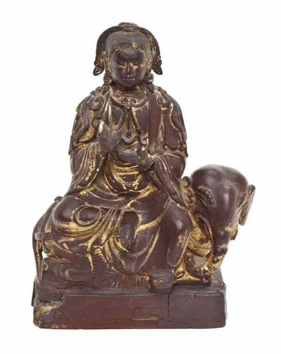 Appraisal: A Chinese Lacquered Wood Figure depicted wearing traditional robes and