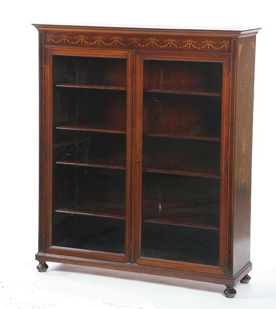 Appraisal: BOOKCASE Mahogany with a molded cornice over two glazed doors