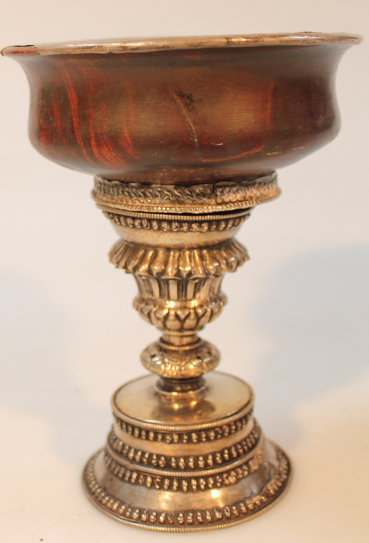 Appraisal: A Tibetan hardwood and white metal incense burner with removable