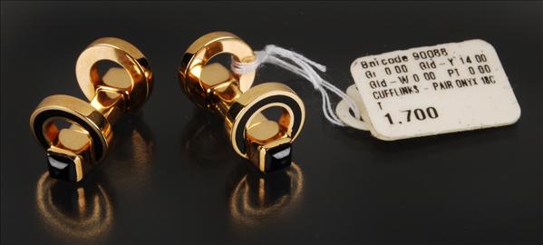 Appraisal: A pair of carat yellow gold and onyx cufflinks the