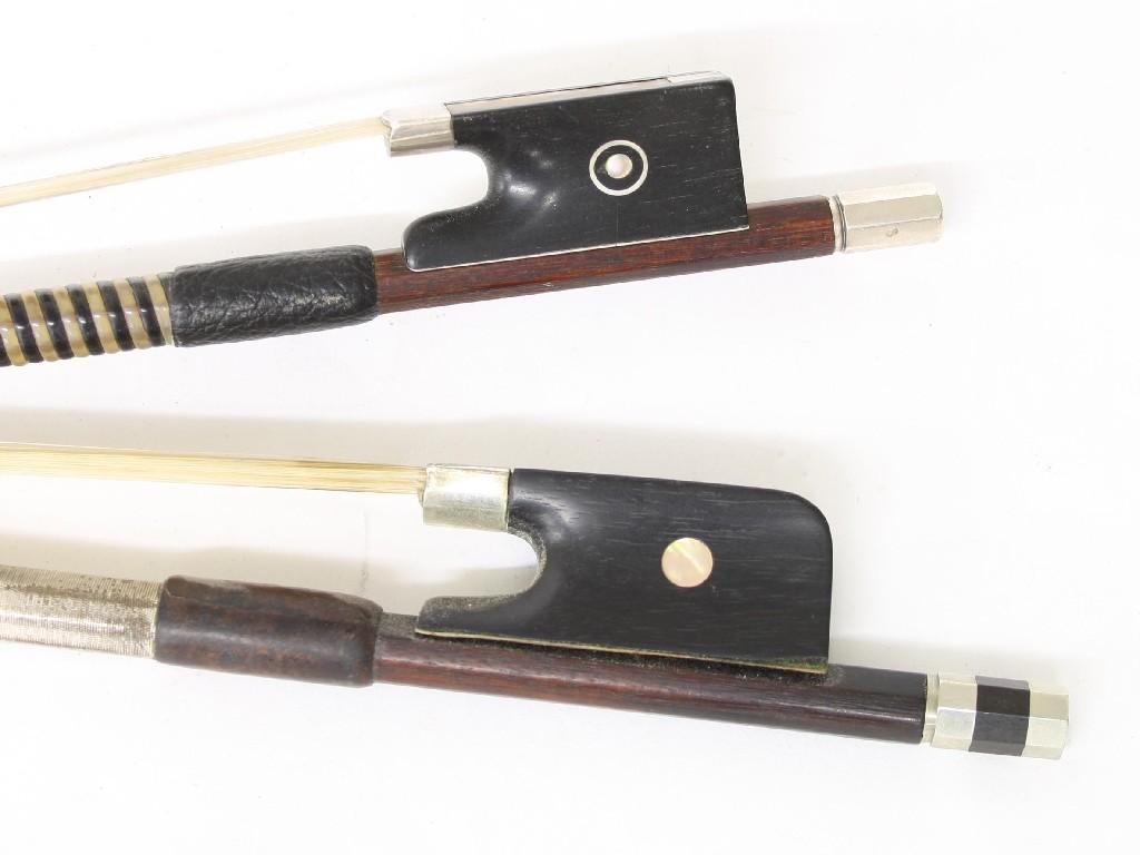 Appraisal: Nickel mounted violoncello bow and a nickel mounted violin bow