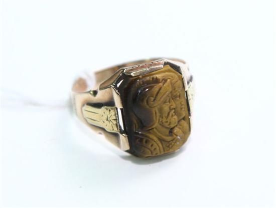 Appraisal: MAN''S CAMEO RING Carved Tiger''s Eye stone with a double