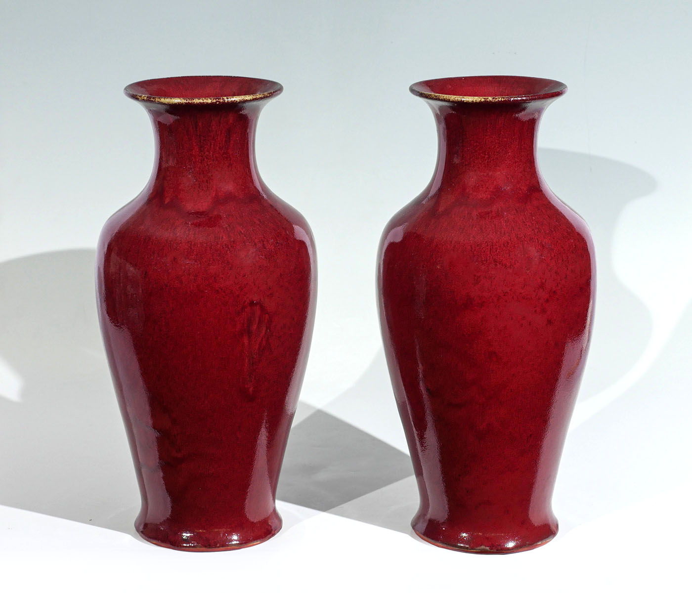 Appraisal: PAIR OF CHINESE RED GLAZED CONTEMPORARY VASES - Tall Chinese