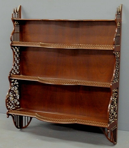 Appraisal: Chippendale style mahogany carved pierced hanging shelf th c h