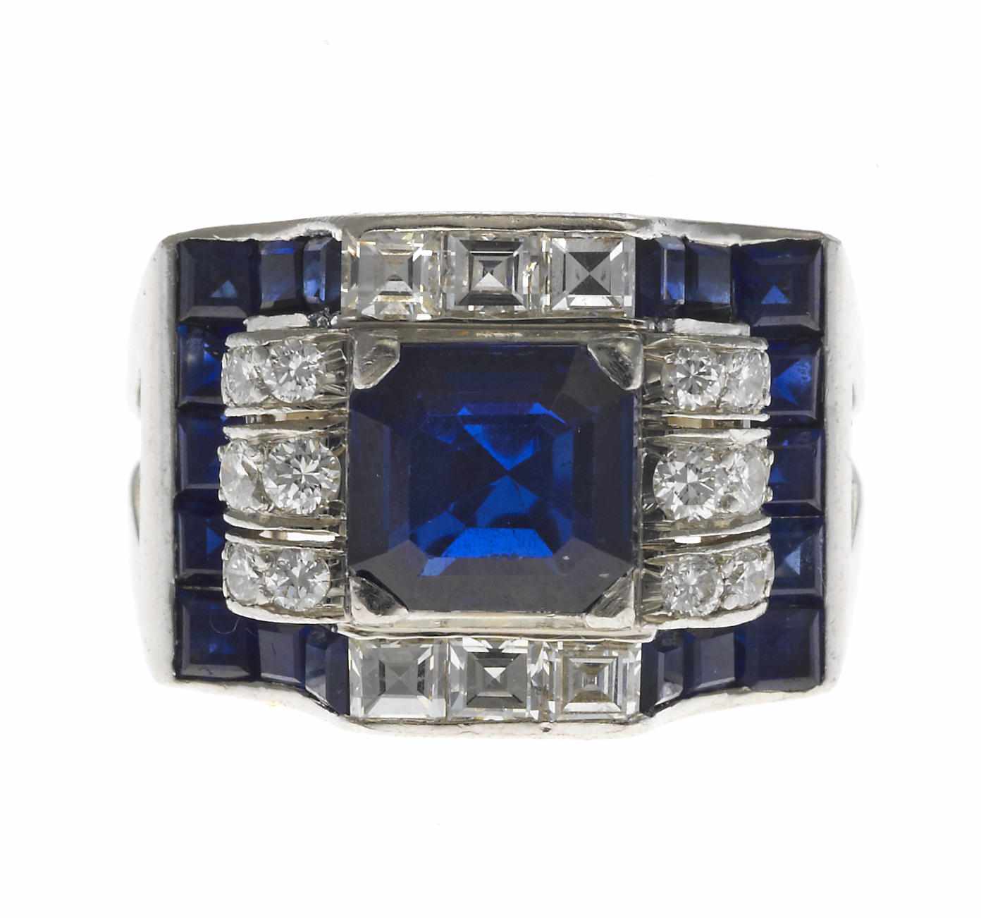 Appraisal: A sapphire and diamond ring central cut-corner square step-cut sapphire