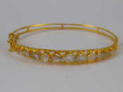 Appraisal: A yellow metal tests carat gold rose cut diamond bangle