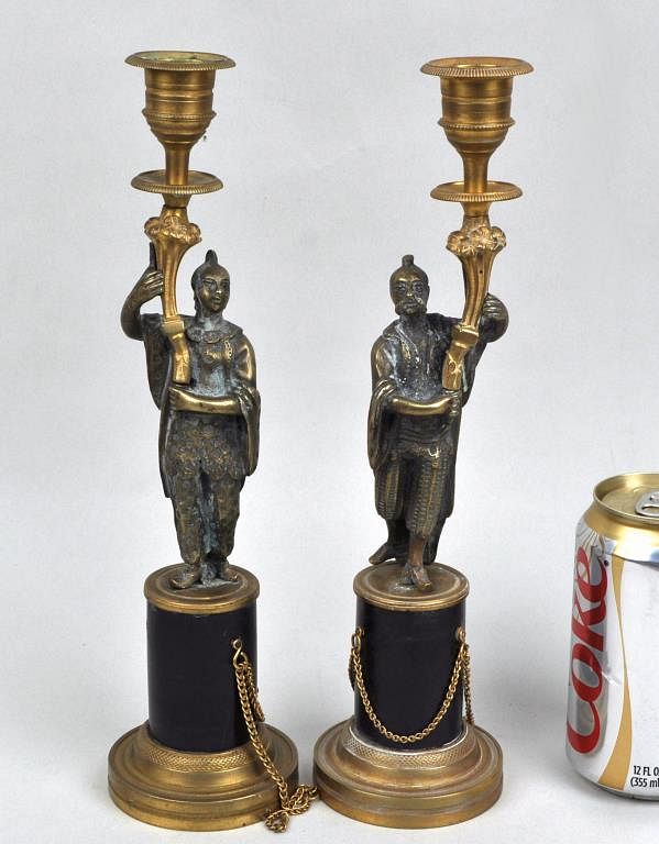 Appraisal: Pair Continental Brass Orientalist Candlesticks depicting an Asian couple holding