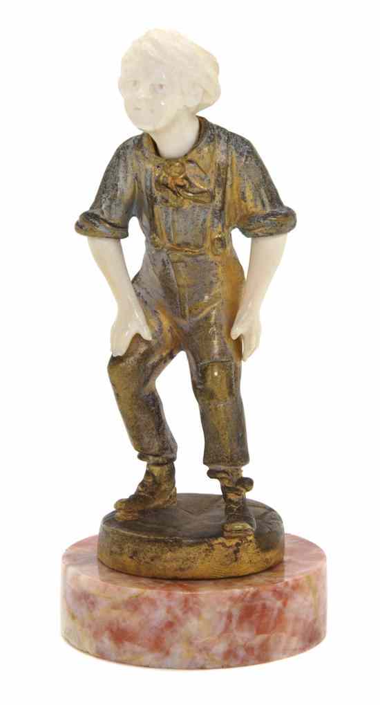 Appraisal: A French Gilt Bronze and Ivory Figure depicting a youth