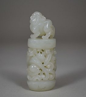 Appraisal: CHINESE CELADON HUED WHITE JADE STUDYDepicting a fu-dog seated atop