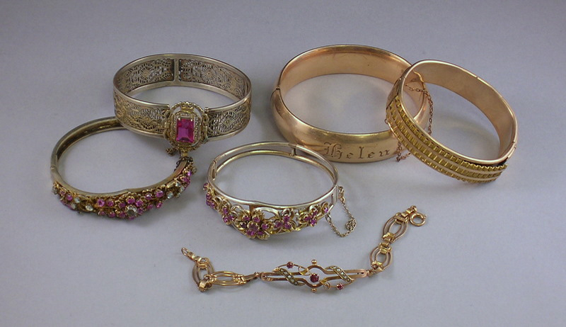 Appraisal: Four Gold Bangle Bracelets and a Gold Gemstone and Seed