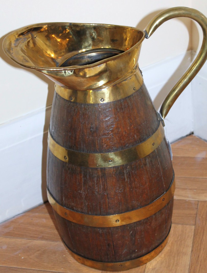 Appraisal: A thC brass bound coopered oak jug cm