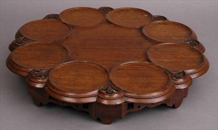 Appraisal: CHIPPENDALE-STYLE CARVED MAHOGANY LAZY SUSAN The rotating octafoil top with