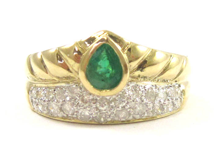 Appraisal: EMERALD DIAMOND AND FOURTEEN KARAT GOLD RING with round-cut diamonds