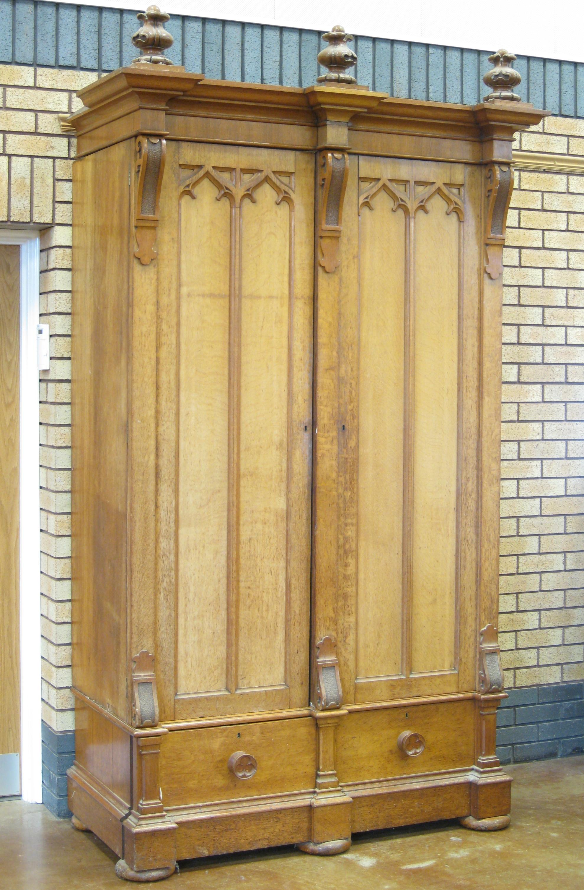 Appraisal: A Victorian light oak Gothic style Wardrobe with three carved