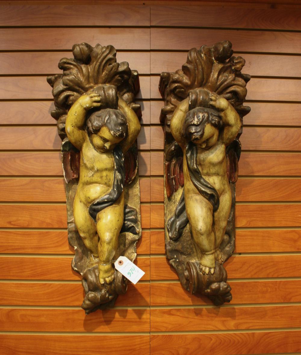 Appraisal: A PAIR OF FIGURAL CARVED WOOD AND MOLDED GESSO CORBELS