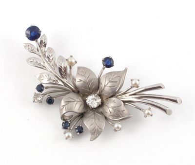 Appraisal: A floral brooch set with two diamonds six sapphires and