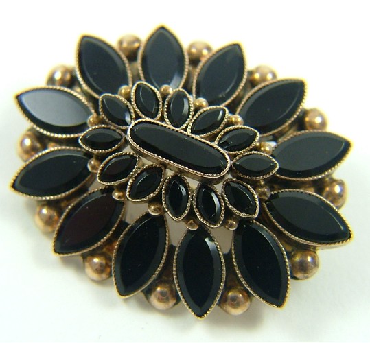 Appraisal: BLACK ONYX AND TEN KARAT GOLD BROOCH set with marquise