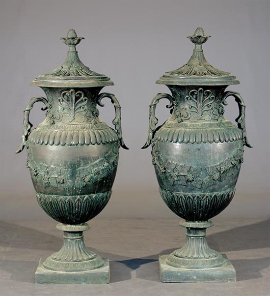 Appraisal: Pair bronze covered garden urns Classical urn form having domed