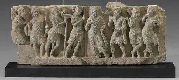 Appraisal: A Gandharan grey schist narrative relief fragment nd- rd Century