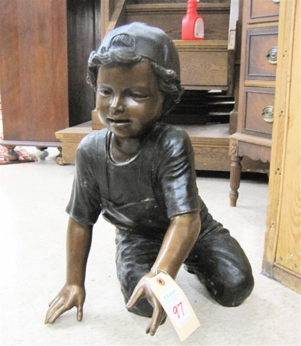 Appraisal: A FIGURAL BRONZE SCULPTURE young boy kneeling next to a