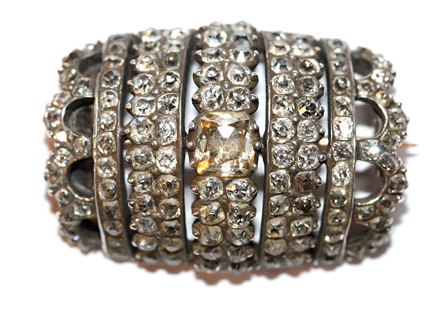 Appraisal: A GEORGIAN DIAMOND SET BARREL SHAPED BROOCH central light sherry