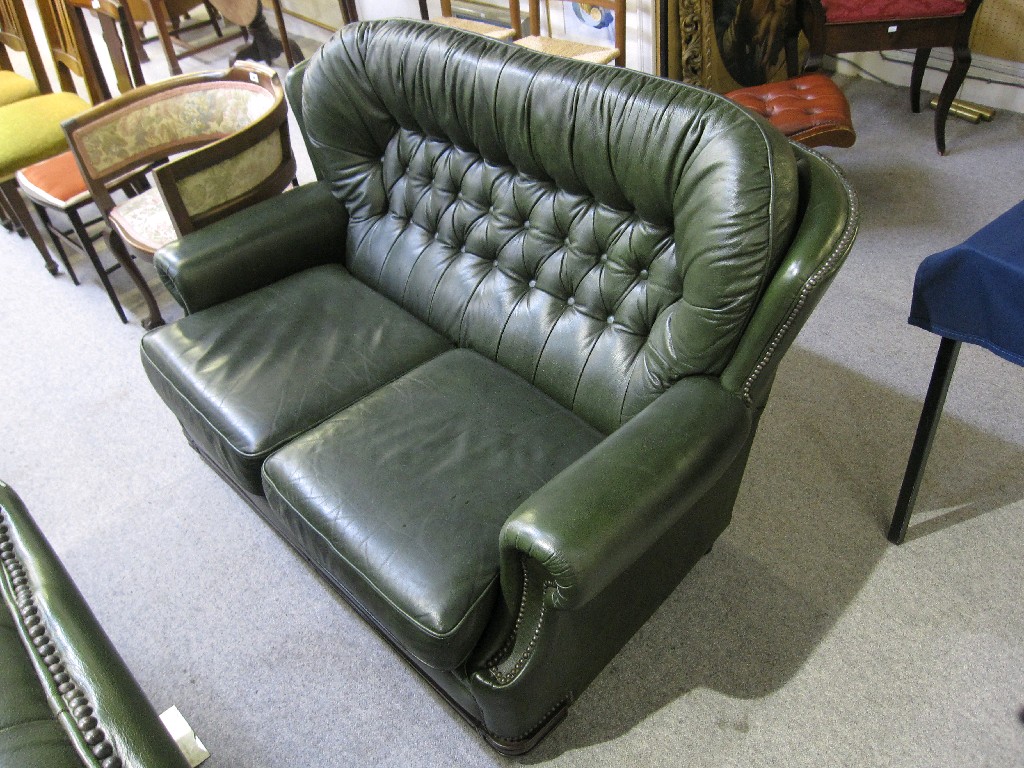 Appraisal: Green leather Chesterfield style two seater settee