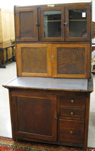 Appraisal: AN OAK KITCHEN HOOSIER CABINET the Hoosier Manufacturing Co New