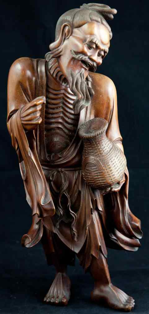 Appraisal: JAPANESE CARVED WOOD FIGURE OF AN ASCETIC the wizened and