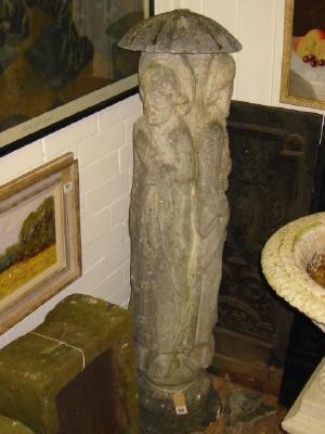 Appraisal: A COMPOSITION STONE FIGURAL PILLAR modelled as three scholars standing