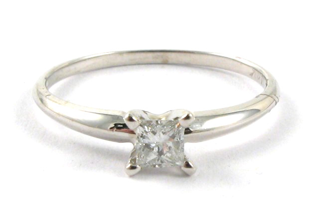 Appraisal: DIAMOND AND FOURTEEN KARAT GOLD RING centering a princess-cut diamond