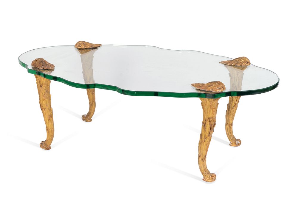 Appraisal: A French Carved Giltwood and Cartouche-form Glass Coffee Table A