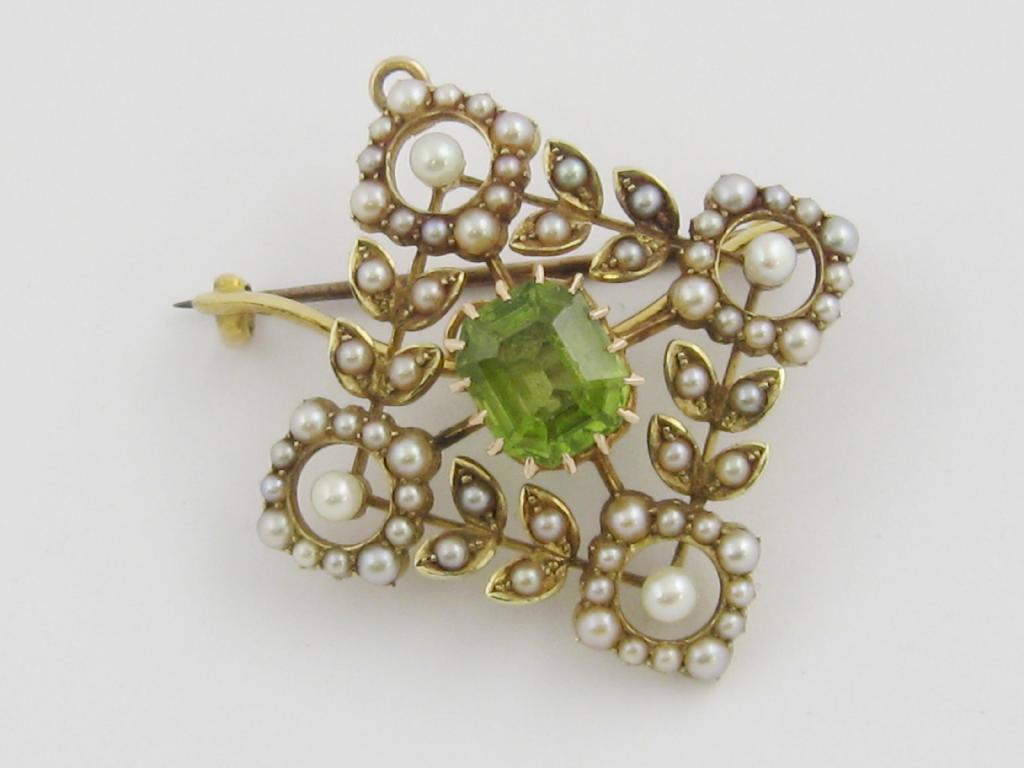 Appraisal: An Edwardian Peridot and Seed Pearl Pendant Brooch the central