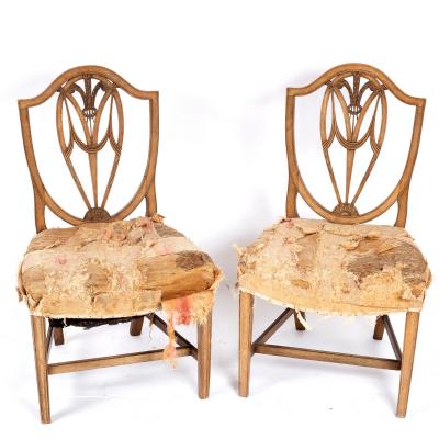 Appraisal: A pair of George III mahogany side chairs the shield