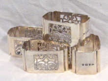 Appraisal: A set of four rectangular pierced silver napkin rings hallmarked