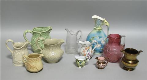 Appraisal: COLLECTION OF PITCHERS Comprising two cream-glazed molded examples a similar