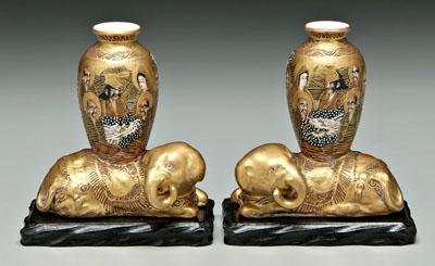 Appraisal: Pair Japanese Satsuma elephants the recumbent caparisoned beasts bearing vases