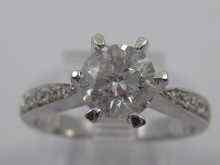 Appraisal: A white metal tests ct gold diamond solitaire ring with