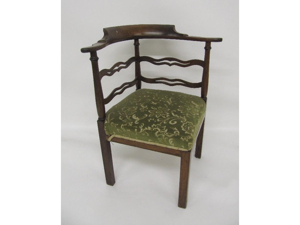 Appraisal: A Georgian mahogany corner chair the top bearing splayed arm