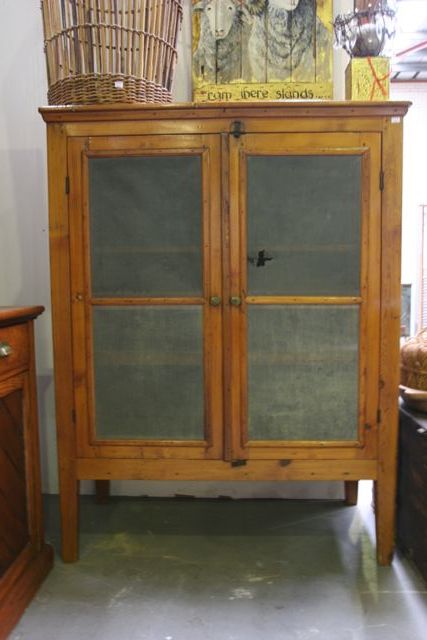 Appraisal: An Australian pine meat safe original iron pressed panels on