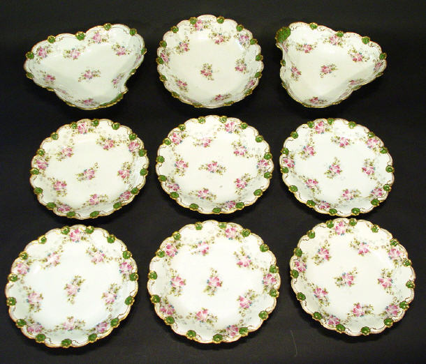 Appraisal: Nine piece Limoges porcelain dessert service hand coloured and transfer